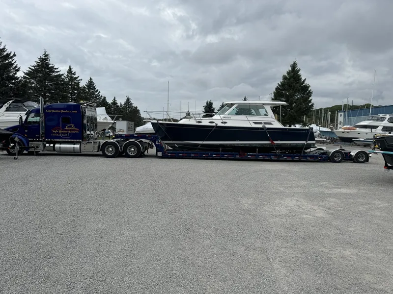 Boat transport of a Back Cove 31 motor yacht on a specialized Waltron low boy style yacht transport trailer